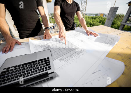 Working at the construction site outdoors Stock Photo