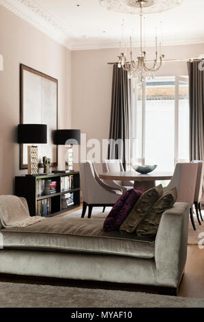 Sofa and dining table in modern living room Stock Photo - Alamy