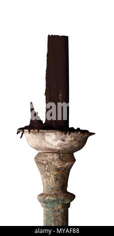Black candle on ancient candle holder. Stock Photo