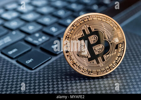 Bitcoin cryptocurrency golden coin on a keyboard Stock Photo