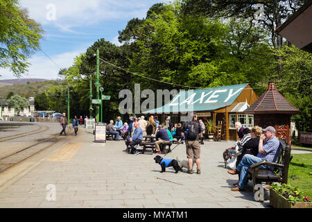 Train passengers waiting outside the cafe and booking office at Laxey Station. Laxey, Isle of Man, British Isles, Europe Stock Photo