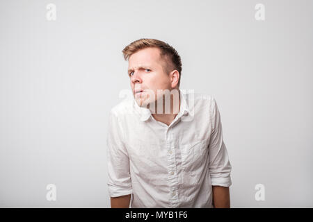 Caucasian man having hearing problem listening to something Stock Photo