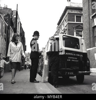 1950s, historical, a British policeman talks to an express air freight dellivery manwith parcel at the back of his van, parked in a London side street, England, UK. Stock Photo