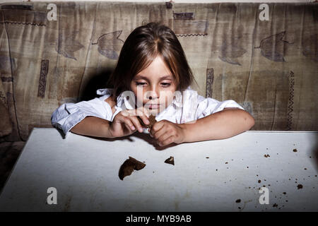 Child abuse. Poor child in slum begging you for help concept for poverty or hunger people, Stock Photo