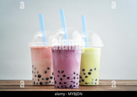 Variety Of Bubble Tea In Plastic Cups With Thick Straws Stock Photo,  Picture and Royalty Free Image. Image 81599835.