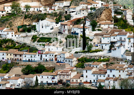 The picturesque Spanish town of Montefrio with its traditional whitewashed houses rising up the side of a hill in the Granada region of Andalucia. Stock Photo