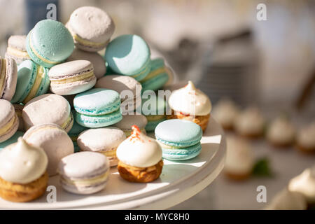 colorful macaroons at the festive table. wedding reception in a restaurant