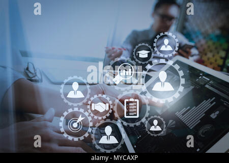 Human resources management with recruitment business working concept. HR manager is selecting candidate for hiring with virtual screen computer. Stock Photo