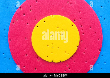 Close-up of a relatively new archery target - with gold, red and blue scoring rings. Stock Photo