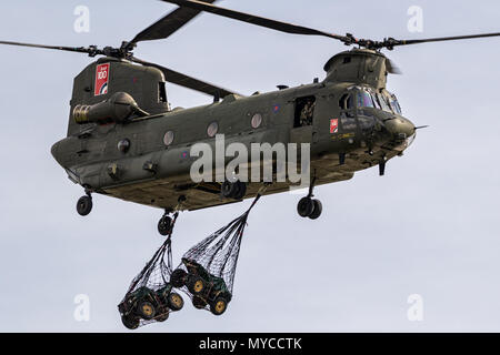 BERLIN - APR 27, 2018: British Royal Air Force Boeing CH-47F Chinook transport helicopter slingload demonstration at the Berlin ILA Air Show. Stock Photo