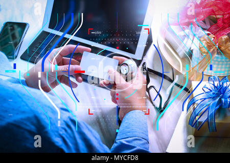 Health care and medical services with circular AR diagram record.Gift giving,medical doctor Hand with credit card and hand with gift. Stock Photo