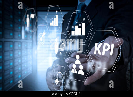 Key Performance Indicator (KPI) workinng with Business Intelligence (BI) metrics to measure achievement and planned target. Stock Photo