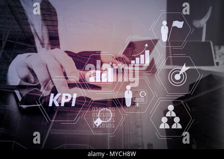 Key Performance Indicator (KPI) workinng with Business Intelligence (BI) metrics to measure achievement and planned target.businessman working with sm Stock Photo