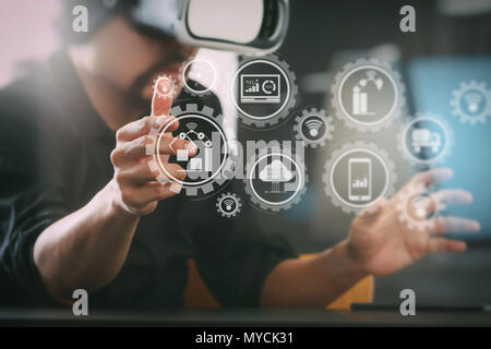 Smart factory and industry 4.0 and connected production robots exchanging data with internet of things (IoT) with cloud computing technology. Stock Photo