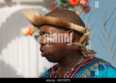 Male Zulu singer with tribal face paint Stock Photo