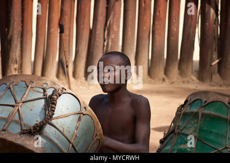 Swaziland, Africa: Young African man playing traditional drumb Stock Photo