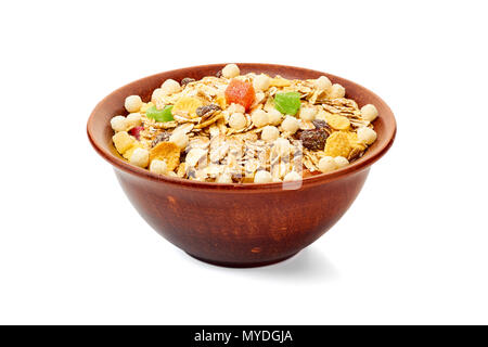 Bowl of muesli with dried exotic fruits on white Stock Photo
