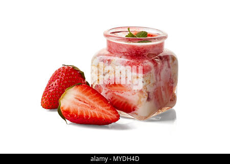 Yogurt and strawberries dessert in jar on white Stock Photo