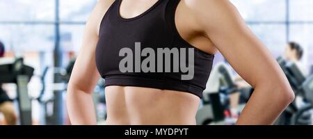 Young woman in sports top, cropped portrait. Stock Photo