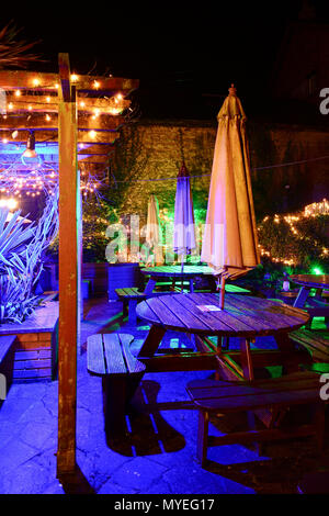 The illuminated beer garden at the Village Inn, Old Village, Shanklin on the Isle of Wight, looks enchanting at night after the rain. Stock Photo