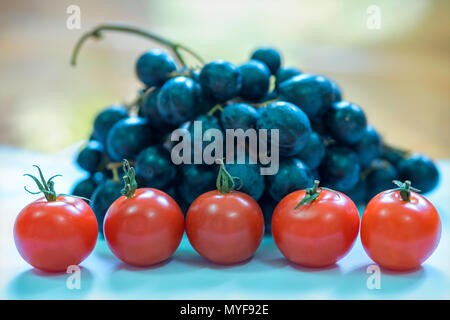 Red cherry tomatoes isolated on white background. This is a fruit rich in vitamin C and minerals that are beneficial to human health Stock Photo