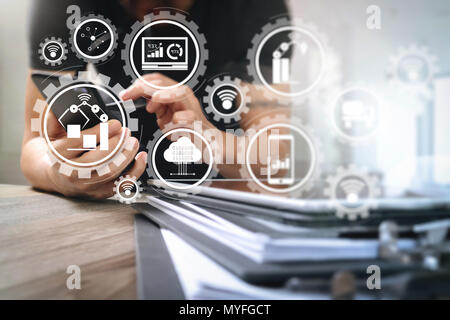 Smart factory and industry 4.0 and connected production robots exchanging data with internet of things (IoT) with cloud computing technology.Designer  Stock Photo