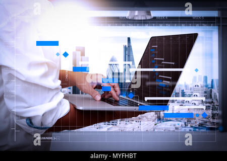 Project manager working and update tasks with milestones progress planning and Gantt chart scheduling diagram.businessman working on his laptop in off Stock Photo