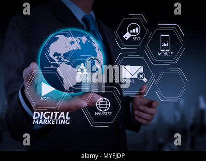Digital marketing media (website ad, email, social network, SEO, video, mobile app) in virtual screen.businessman hand show 3d world  with padlock as  Stock Photo