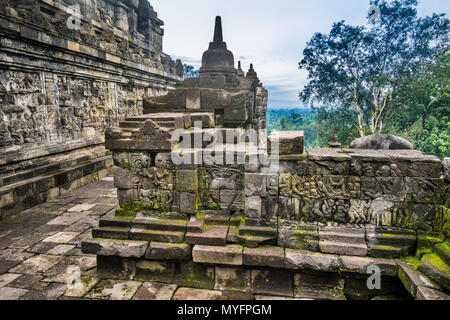 balustraded corridor with bas-reliefs on either side at the 9th century Borobudur Buddhist temple, Central Java, Indonesia Stock Photo