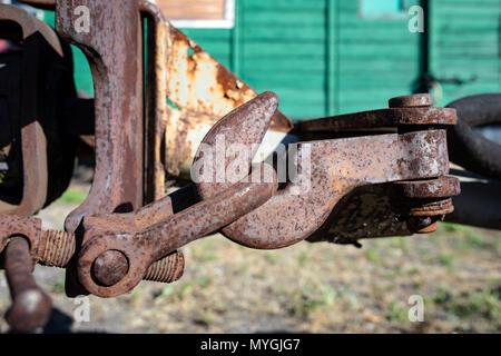 Hook, rail car rusty fastening. Vintage narrow-gauge railways. Stock Photo