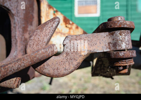 Hook, rail car rusty fastening. Vintage narrow-gauge railways. Stock Photo