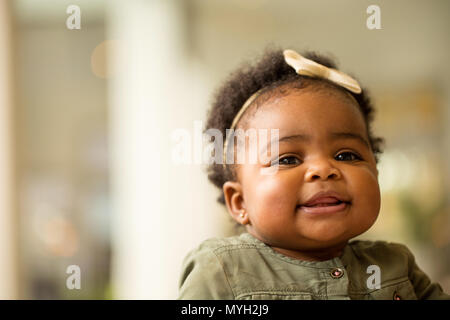 African American baby girl laughing and smiling. Stock Photo