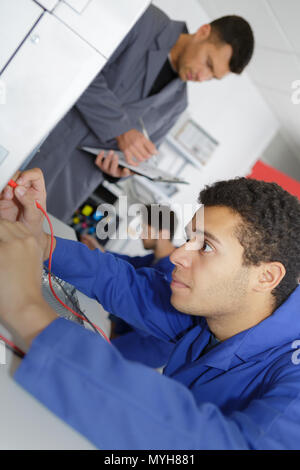 modern printing machine operator checking machine Stock Photo - Alamy