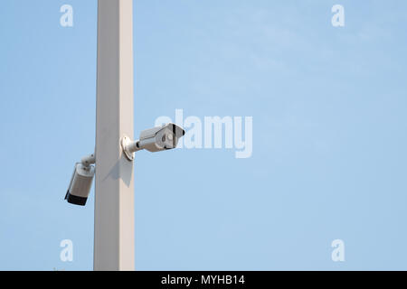 CCTV Camera. Security surveillance system with blue sky. Stock Photo
