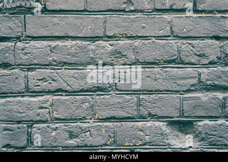 Old grey brick wall for background Stock Photo