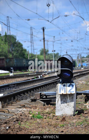 Railway traffic light (semaphore) against the background of a day railway landscape. Signal device on the railway track Stock Photo