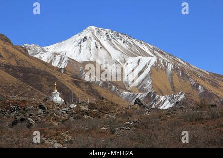 Mount Tserko Ri and small stupa. Spring scene in the Langtang valley. Stock Photo