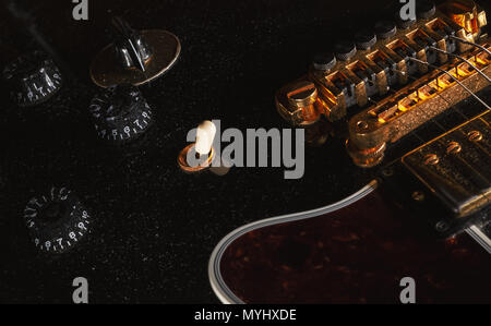 Details of an old dusty electric guitar. Stock Photo