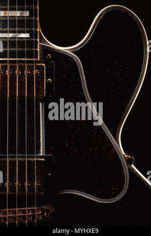 Details of an old dusty electric guitar. Stock Photo