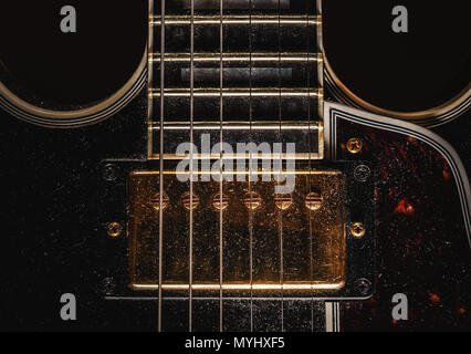 Details of an old dusty electric guitar. Stock Photo