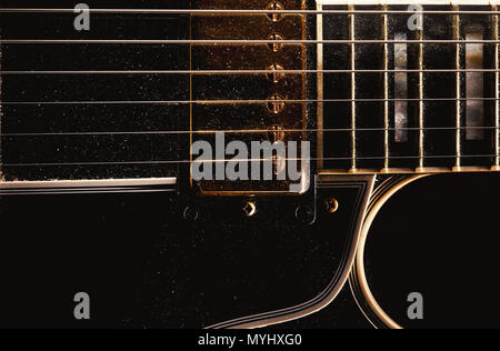 Details of an old dusty electric guitar. Stock Photo