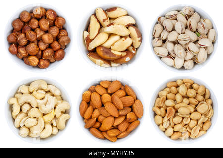 Nuts nut collection from above hazelnuts peanuts bowl isolated on a white background Stock Photo