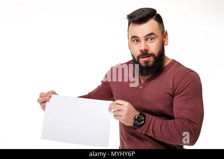 handsome bearded man holding white card. Stock Photo