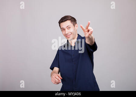 Cool positive guy showing peace sign Stock Photo