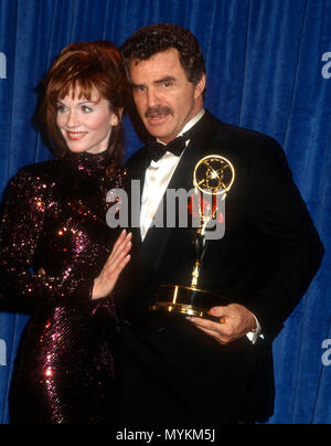 PASADENA, CA - AUGUST 25: (L-R) Actress Marilu Henner and actor Burt Reynolds attend the 43rd Annual Primetime Emmy Awards on August 25, 1991 at Pasadena Civic Auditorium in Pasadena, California. Photo by Barry King/Alamy Stock Photo Stock Photo