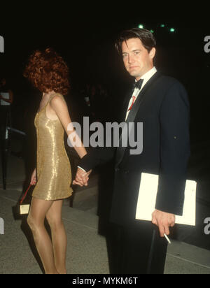 PASADENA, CA - AUGUST 25: (L-R) Actress Lara Flynn Boyle and actor Kyle MacLachlan attend the 43rd Annual Primetime Emmy Awards on August 25, 1991 at Pasadena Civic Auditorium in Pasadena, California. Photo by Barry King/Alamy Stock Photo Stock Photo