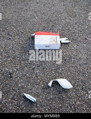 Mosa Cream Chargers. Nitrous oxide canister (laughing gas) and balloon used to get a legal high known as hippy crack. Stock Photo