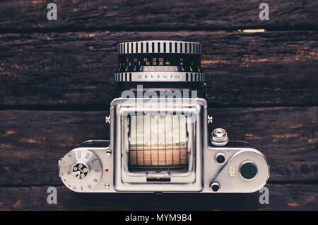 Analog Old Retro Camera With Celluloid Film Isolated On White Background  Stock Photo, Picture and Royalty Free Image. Image 99579900.