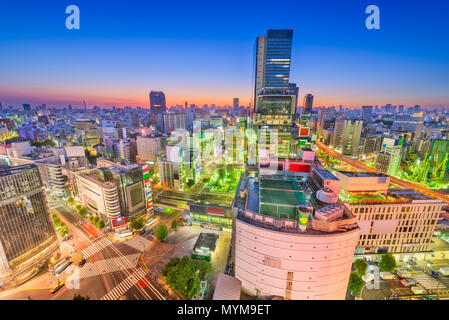 Shibuya, Tokyo, Japan city skyline over the famous scramble crosswalk at dusk. Stock Photo