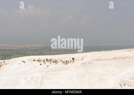 View from the top of the travertine terraces with their thermal pools at the hot springs, Pumakkale, Anatolia, Turkey a UNESCO World Heritage Site Stock Photo